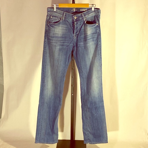 Men's 7 FOR ALL MANKIND light wash blue jeans.